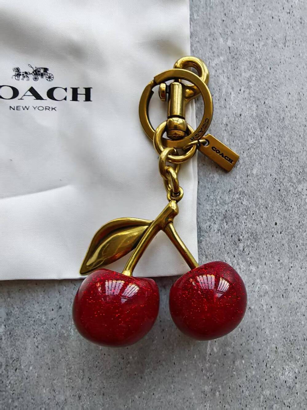 Coach Gold-Tone Cherry Key Charm with Red Glitter